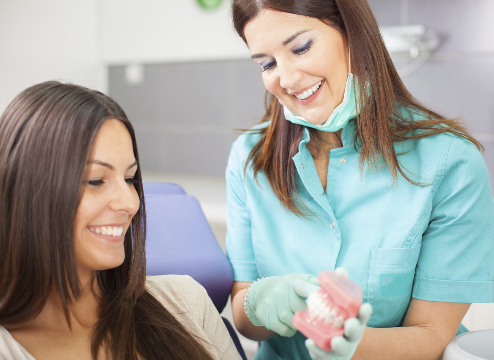 Dental assistant with a patient