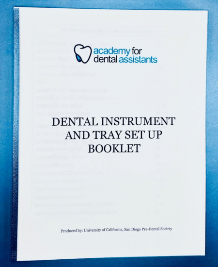 Cover of a school supply a school sells. The product is called "Dental Instrument and Tray Set Ups Booklet" The cover is white and the font is black. The school's logo is included at the top of the cover.