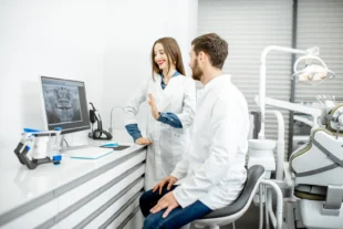 Photo of a dental assistant and dentist for blog usage